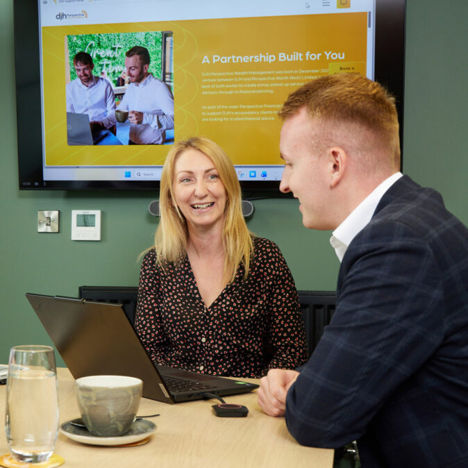DJH Perspective Wealth Management advisers at a meeting